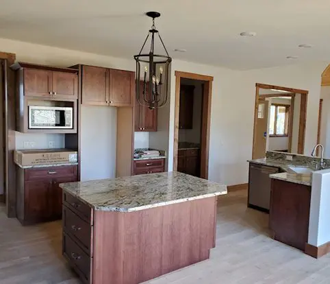 Rice Furniture & Design Center | custom built cabinets in dark wood for kitchen to match wood elements in the home Rice Furniture & Design Center | custom built cabinets in dark wood for kitchen to match wood elements in the home