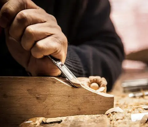 Rice Furniture & Design Center | furniture designing building a custom piece of furniture with a carving tool Rice Furniture & Design Center | furniture designing building a custom piece of furniture with a carving tool