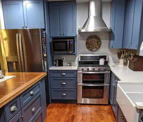 Rice Furniture & Design Center | Design Center custom built cabinets for a kitchen painted a dark blue with silver fixtures Rice Furniture & Design Center | Design Center custom built cabinets for a kitchen painted a dark blue with silver fixtures